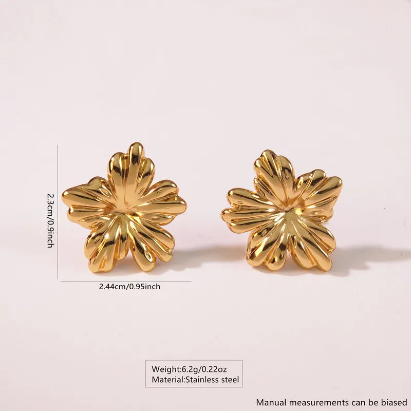 Gold Flower Stud Earrings by Zivnaaz