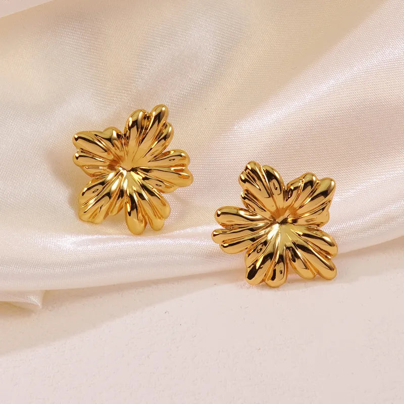 Gold Flower Stud Earrings by Zivnaaz