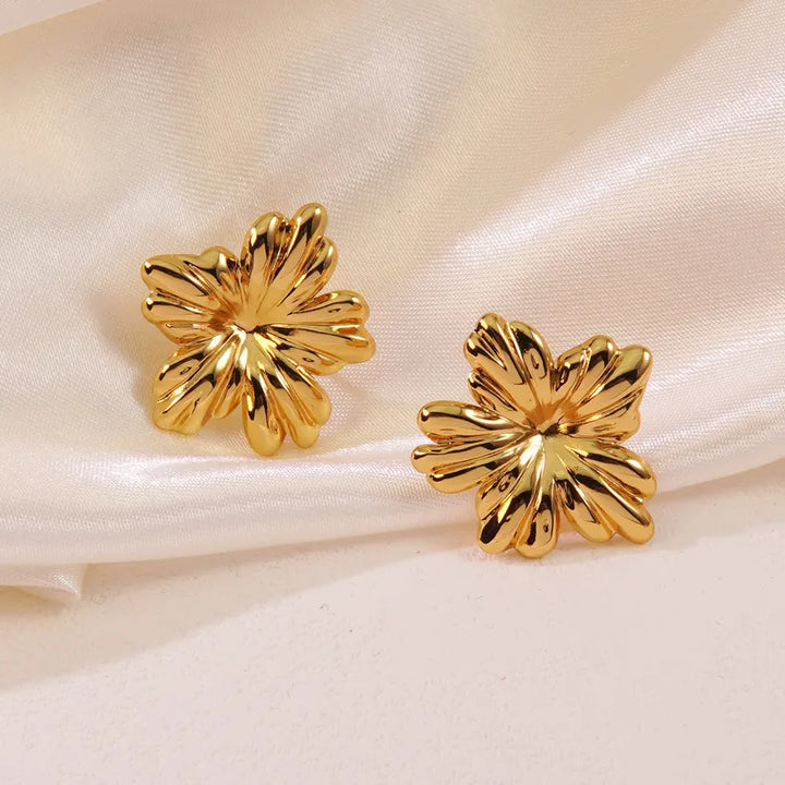 Gold Flower Stud Earrings by Zivnaaz