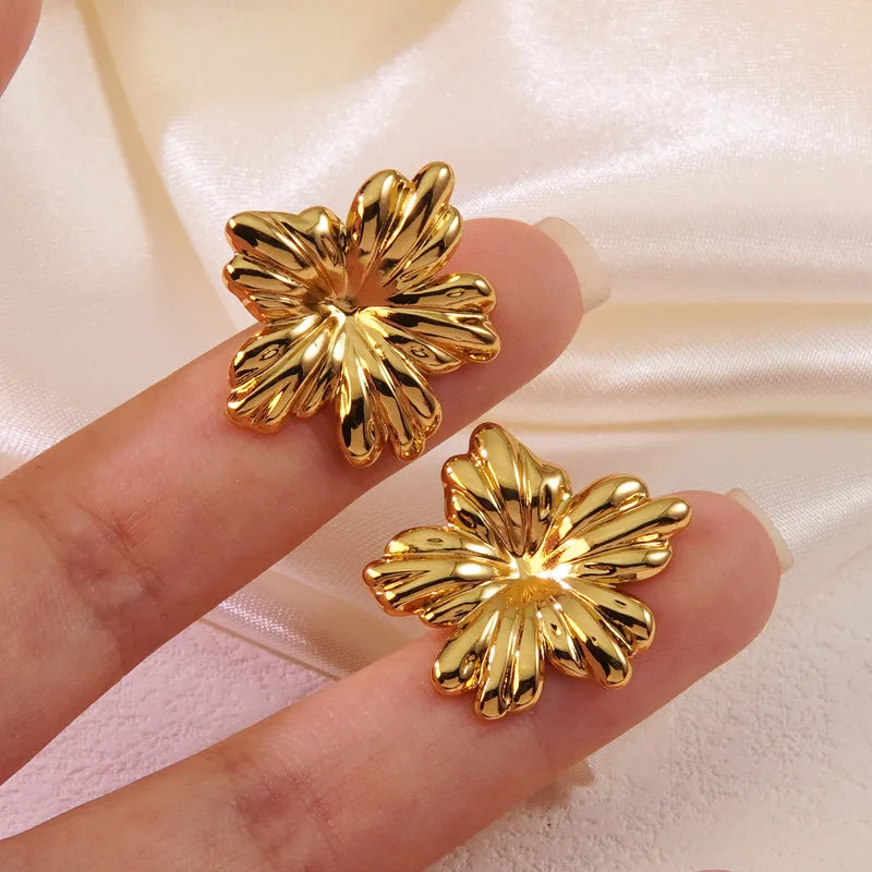 Gold Flower Stud Earrings by Zivnaaz
